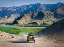 An Australian service light armored vehicle drives through Tangi Valley, Afghanistan, March 29. The terrain of Tangi Valley is notoriously rough, but the ASLAV maneuvers across it with ease, said Australian army Lt. McLeod Wood, a troop leader for 2nd Cavalry Regiment, Mentoring Task Force 2, Combined Team Uruzgan.